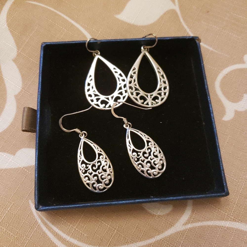 Three pair of silver tone earrings